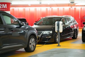 electric electricvehicles two black cars facing charging emobility